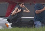 Angelina Jolie -  beams as she boards a private jet in New Orleans 4/17/2015